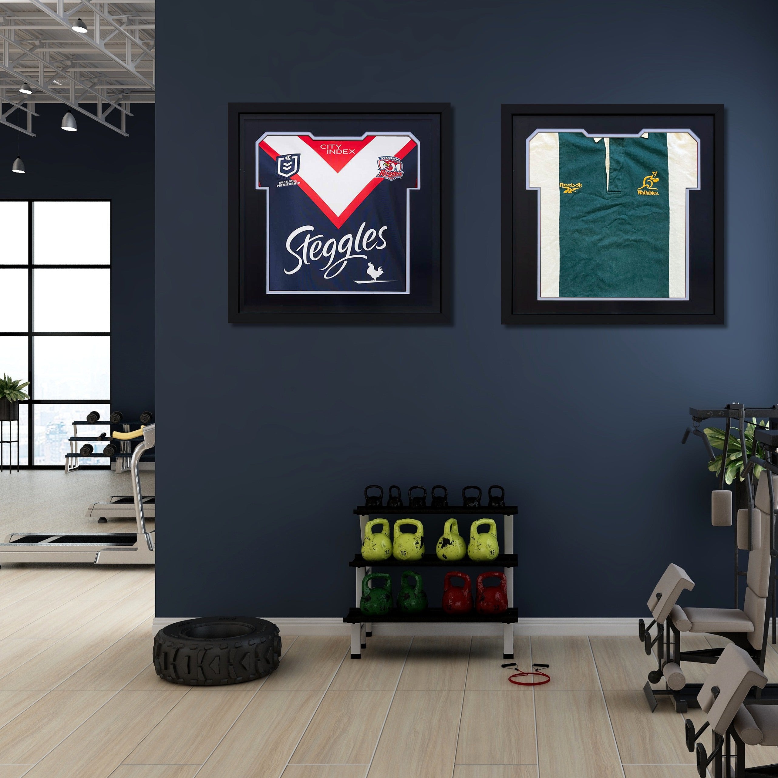 Two framed sports jerseys on a wall in a gym setting with fitness equipment below.